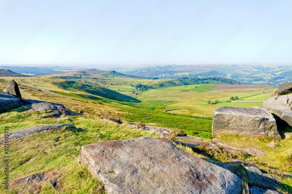 From Stanage Edge across the Derbyshire landscape in the morning sun From Stanage Edge across the Derbyshire landscape in the morning sun