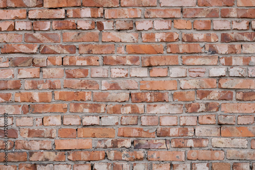 Wall of red bricks. Texture or background of bricks.