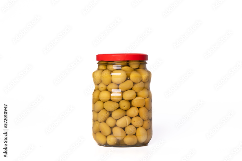 Big green olives in glass jar isolated Big green olives in glass jar isolated