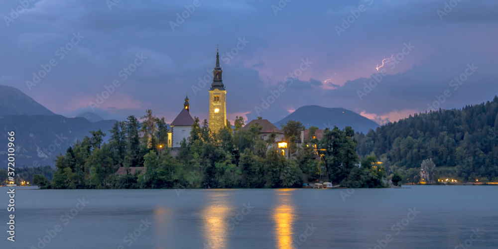 Lake bled with church under lightning