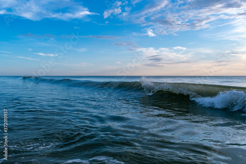 Morning sunrise and waves at the beach