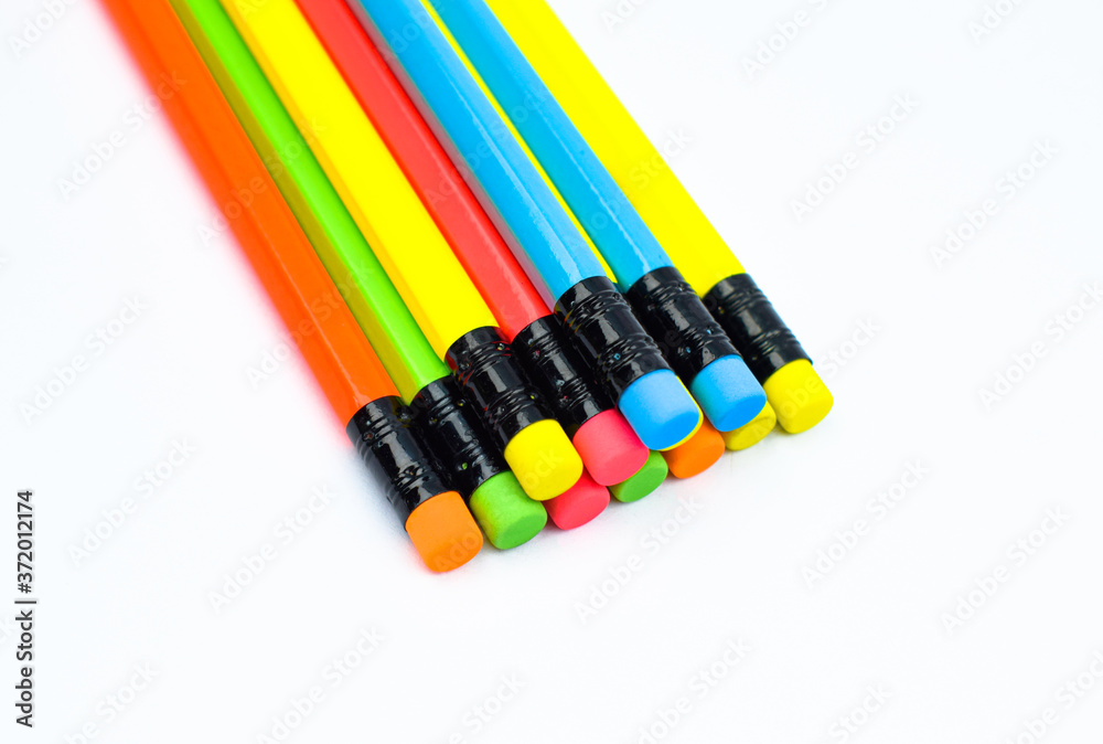 Naklejka premium Triangle shaped pattern made with different colored wood pencil crayons