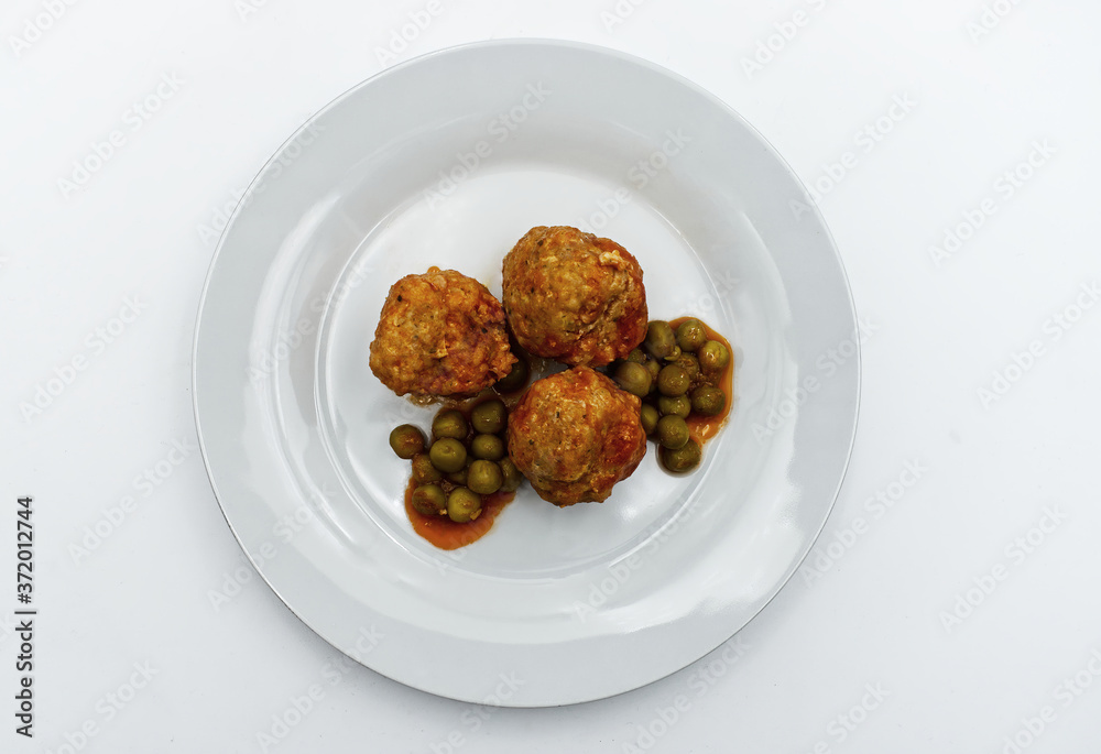 Meatballs with peas in white plate, isolated on white background. Meatballs with peas in white plate, isolated on white background.