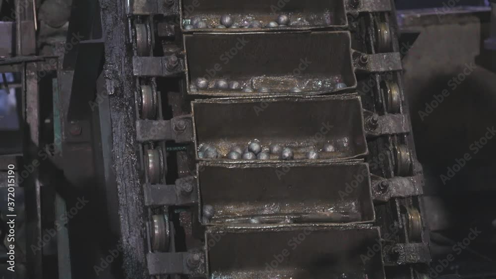 The movement of metal balls on the conveyor, the production of metal
