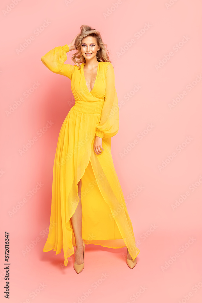 Happy beautiful girl in yellow dress. Happy beautiful girl in yellow dress.