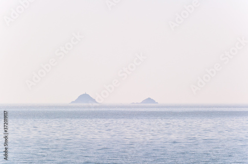Misty island,mysterious seascape in light fog. © Chongbum Thomas Park