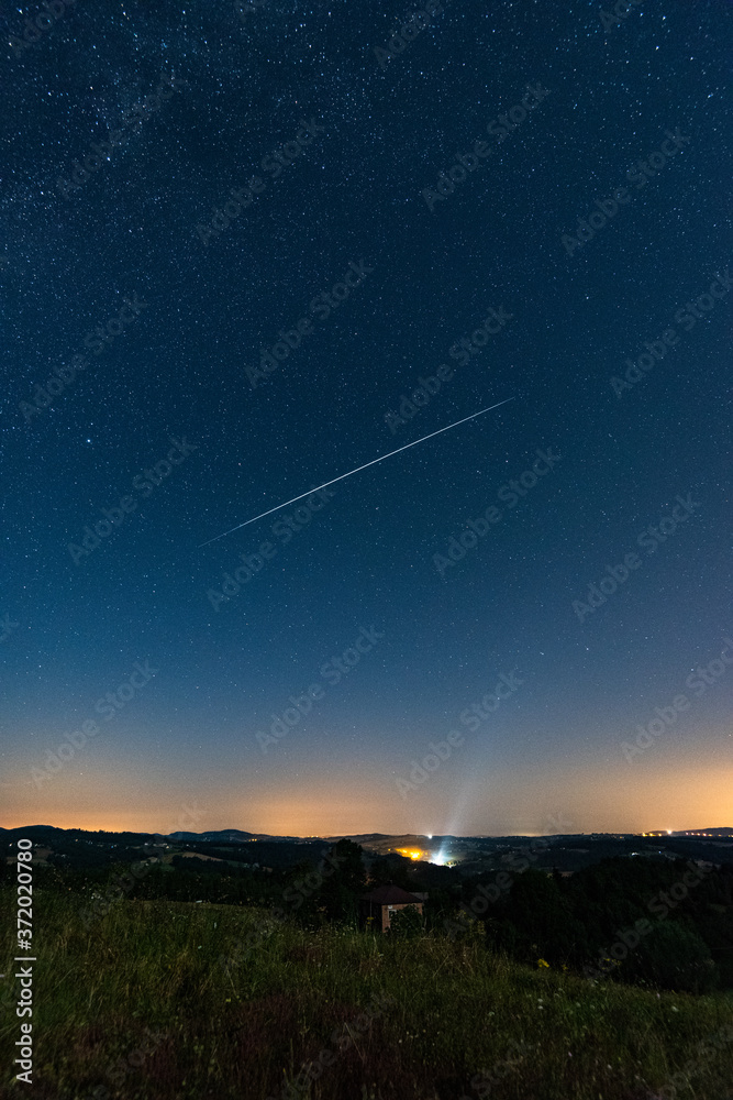 Perseid Meteor Shower. Falling Star at Dark Sky. Night of Shooting Stars Perseid Meteor Shower. Falling Star at Dark Sky. Night of Shooting Stars