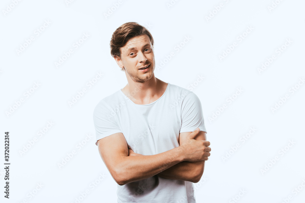 Confident man with crossed arms looking at camera isolated on white Confident man with crossed arms looking at camera isolated on white