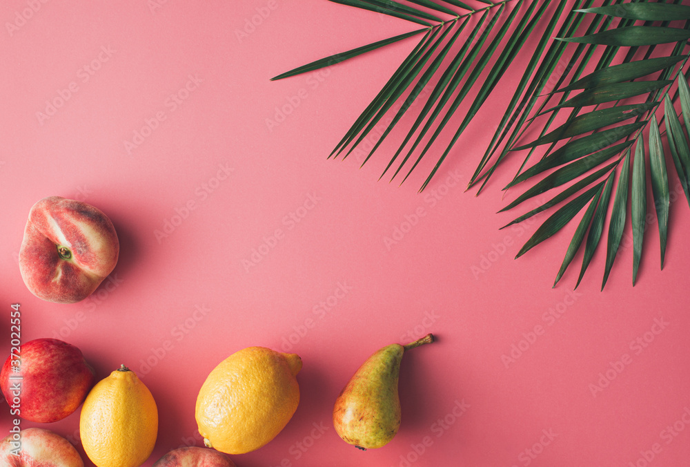 Summer tropical layout made with fresh fruit and green palm leaves on ...
