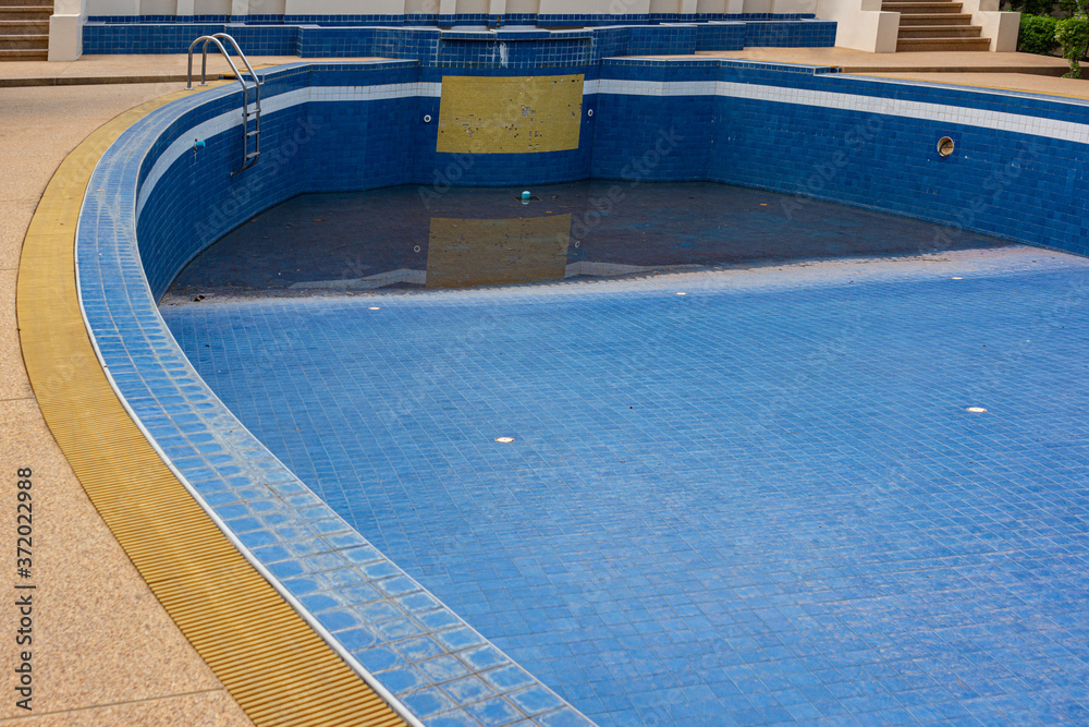 The old and abandoned swimming pool