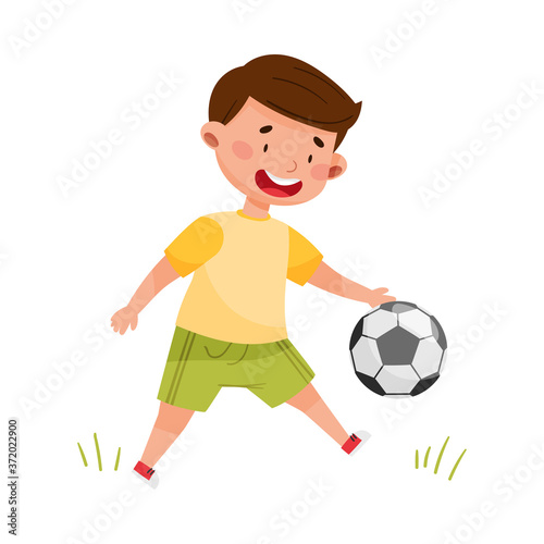 Little Boy Playing Football on Sports Field Vector Illustration