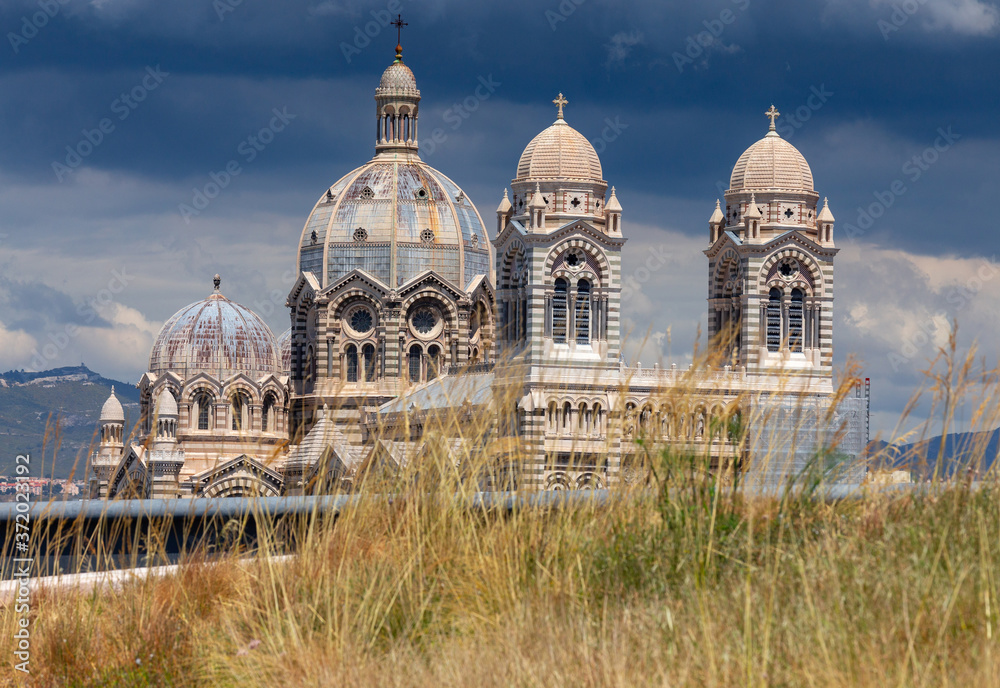 Marseilles. The domes of the old cathedral against the backdrop of a stormy sky.