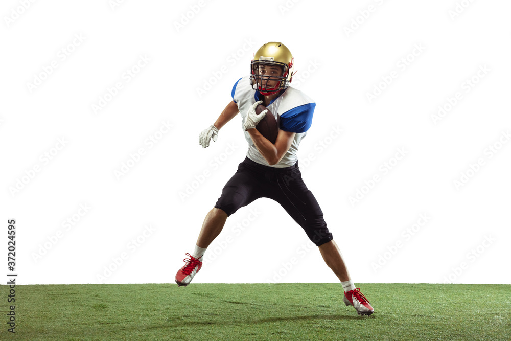 In action. American football player isolated on white studio background with copyspace. Professional sportsman during game playing in action and motion. Concept of sport, movement, achievements.