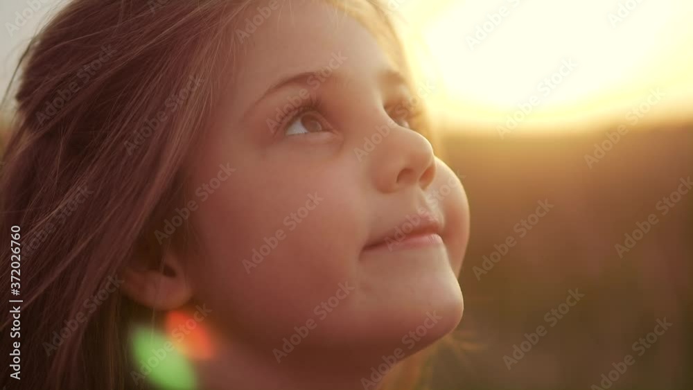 happy little girl child closed her eyes dreams. kid wants a dream come true portrait at sunset. baby daughter silhouette dreaming of a happy childhood. free face sister lifestyle side view thinks happy little girl child closed her eyes dreams. kid wants a dream come true portrait at sunset. baby daughter silhouette dreaming of a happy childhood. free face sister lifestyle side view thinks
