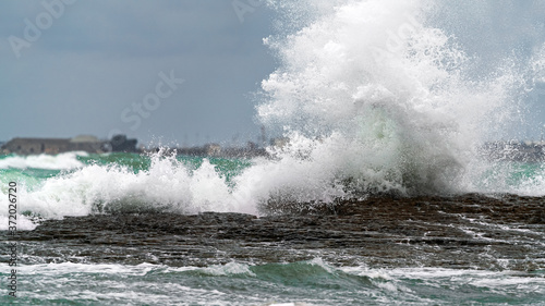 Big waves breaking coastal rocks © Vastram