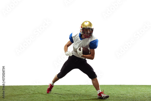 In action. American football player isolated on white studio background with copyspace. Professional sportsman during game playing in action and motion. Concept of sport, movement, achievements.