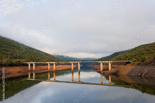 A bridge over the Tagus river as it passes through the Monfragua National Park in Spain