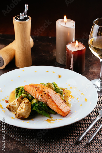 grilled salmon with vegetables and wine