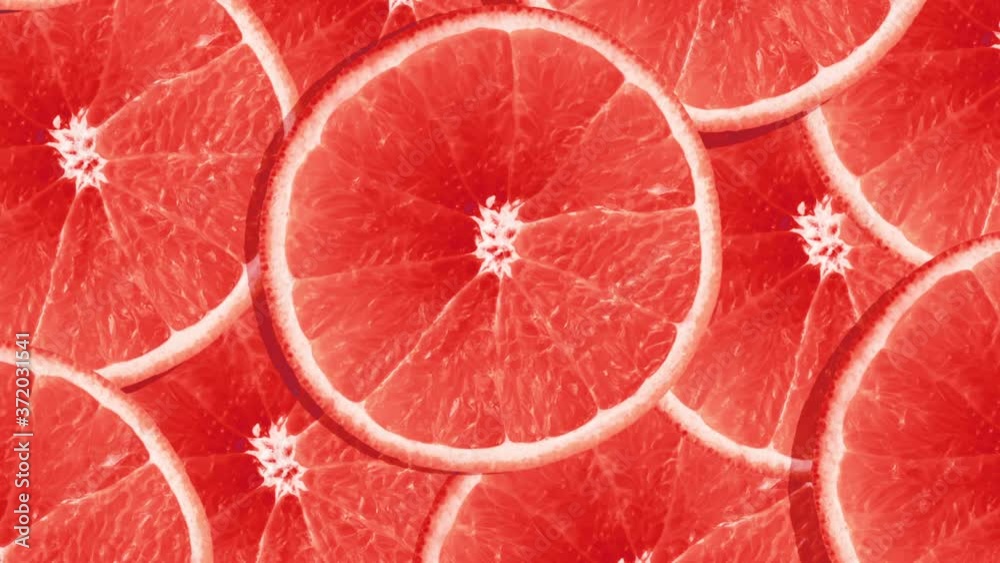 Bright colourful background of rotating red orange fruit grapefruit slices. Motion design. Bright colourful background of rotating red orange fruit grapefruit slices. Motion design.