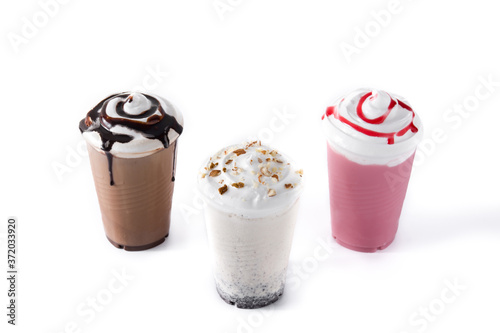 Strawberry, chocolate and white iced milkshakes