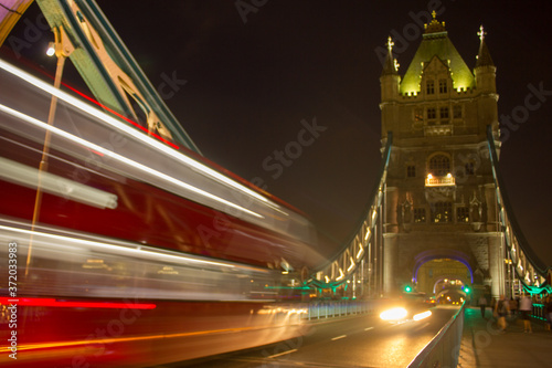 Tower Bridge bus passing in time-lapse at night