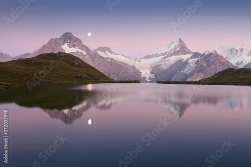 Sunrise view on Bernese range above Bachalpsee lake. Highest peaks Eiger  Jungfrau and Faulhorn in famous location. Switzerland alps  Grindelwald valley. Popular tourist attraction. Europe. 