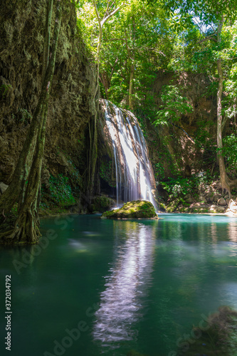 Clear stream that flows through the rocks. Falling into the Emerald Pool  Erawan Kanchanaburi  Thailand.