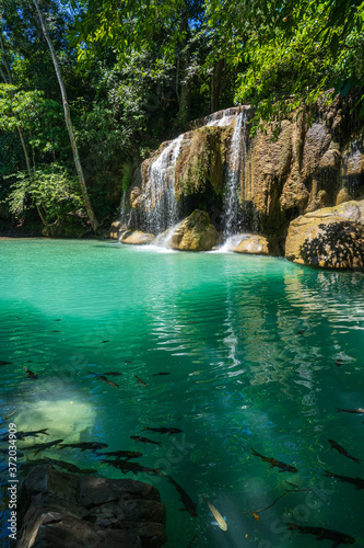 Clear stream that flows through the rocks. Falling into the Emerald Pool  Erawan Kanchanaburi  Thailand.