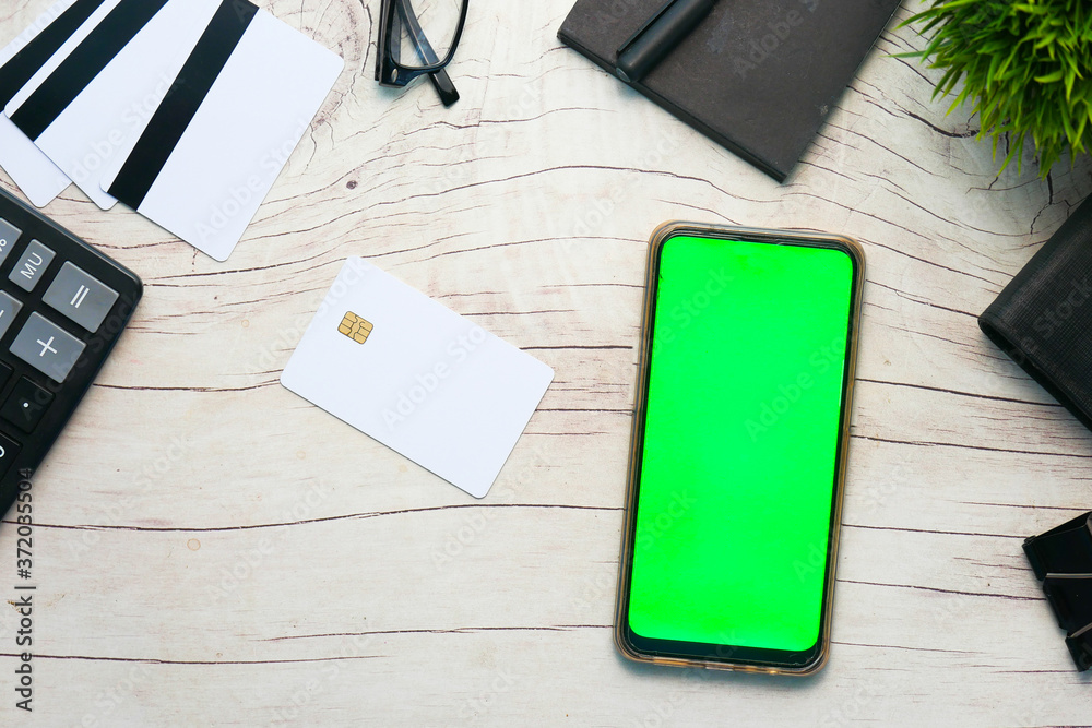 smart phone and credit card on wooden table, Top view smart phone and credit card on wooden table, Top view