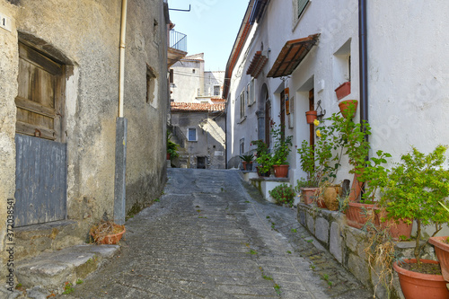 A narrow street among the old houses of Aieta  a rural village in the Calabria region.