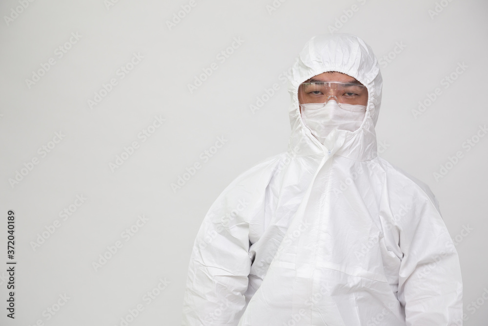 Portrait of Asian doctor or nurse in Personal Protective Equipment or PPE suit and wearing face mask and eyeglasses Portrait of Asian doctor or nurse in Personal Protective Equipment or PPE suit and wearing face mask and eyeglasses