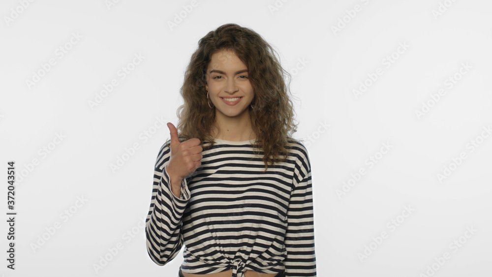 Satisfied woman showing thumbs up on white background. Positive person show like Satisfied woman showing thumbs up on white background. Positive person show like