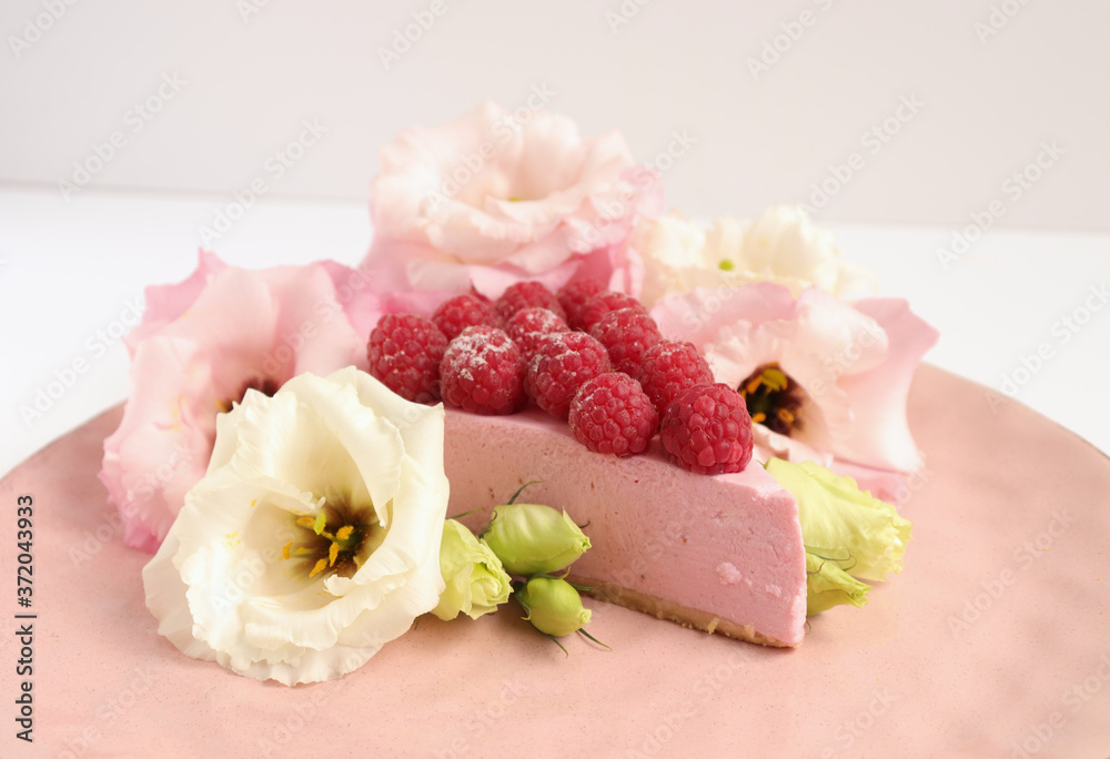 Raspberry cheesecake with berries and fresh flowers on pink plate food photo, sweet cake food photo art, kitchen, menu and restaurant photoshoot Raspberry cheesecake with berries and fresh flowers on pink plate food photo, sweet cake food photo art, kitchen, menu and restaurant photoshoot