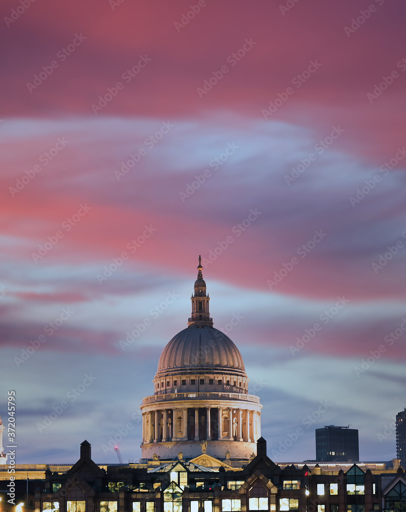 A view across the River Thames at dusk towards St. Paul's Cathedral in London, UK.