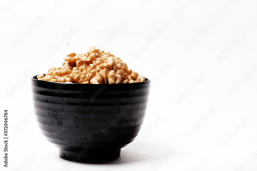 Walnut In Bowl Isolated On White Background. Walnut In Bowl Isolated On White Background.