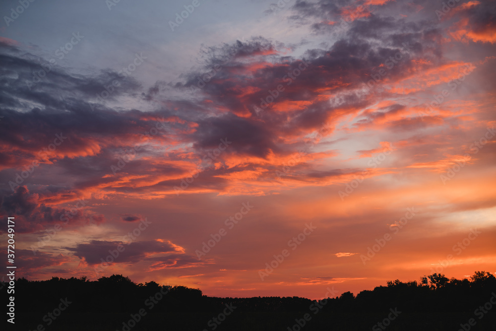Evening walk outside the city. Beautiful colorful pastel sky at sunset. Evening walk outside the city. Beautiful colorful pastel sky at sunset.