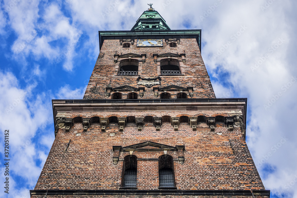 Detail of the Former church of St. Nicholas (Sankt Nikolaj Kirke), now Nikolaj Contemporary Art Center. The church building is famous for its fanciful Neo-Baroque 90 meter spire. Copenhagen. Denmark.