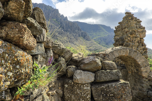Ruins of a fortress in the mountains. Castle of the Principality of Theodoro, a Greek-speaking principality in the south-west of Crimea. Demirji mountains. Famous hiking route.