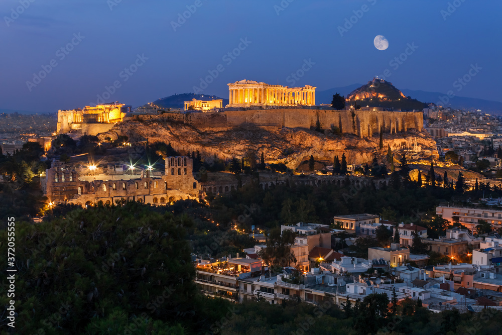 The Parthenon on Acropolis Hill in Athens Greece with full moon