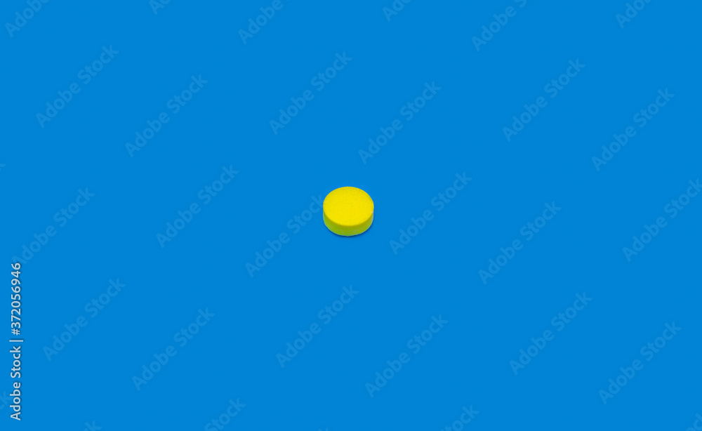 Yellow pill on blue background. Orange pill on indigo background. Blue seamless pattern and yellow pill.