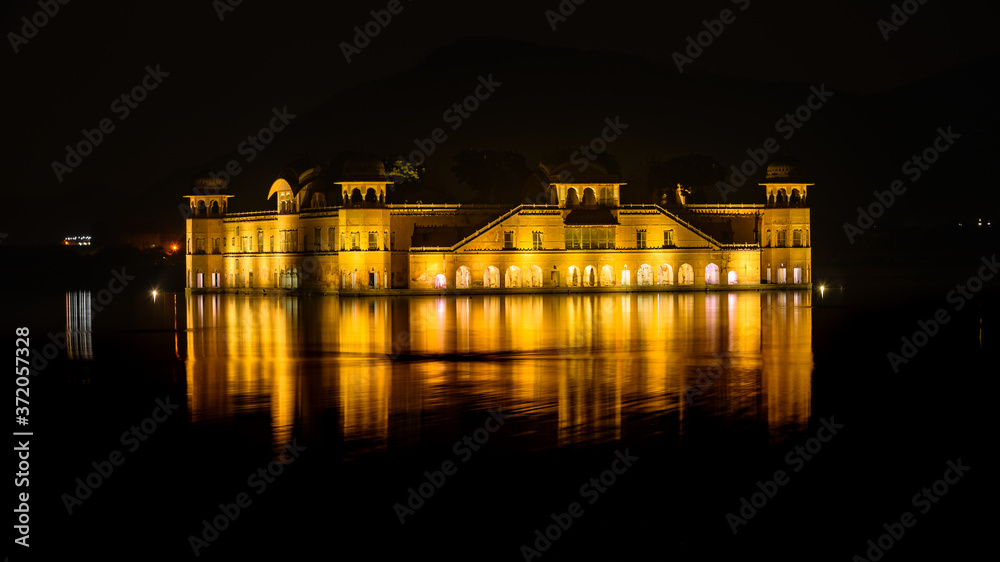 Illuminated night view of Jal Mahal 'Water Palace' is an architectural showcase of Rajput style in the Man Sagar lake in jaipur city, the capital of Rajasthan, India. Illuminated night view of Jal Mahal 'Water Palace' is an architectural showcase of Rajput style in the Man Sagar lake in jaipur city, the capital of Rajasthan, India.