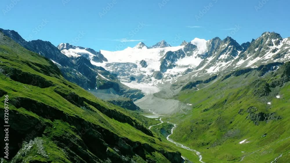 Turquoise lake in the middle of Mountains under the blue sky. Wonderfull landscape in Aerial view with a drone 4k Turquoise lake in the middle of Mountains under the blue sky. Wonderfull landscape in Aerial view with a drone 4k