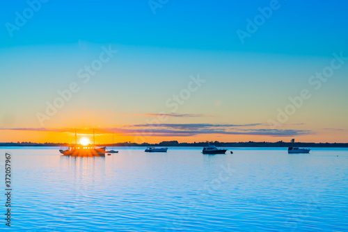 Sunrise over blue water of Tauranga harbour