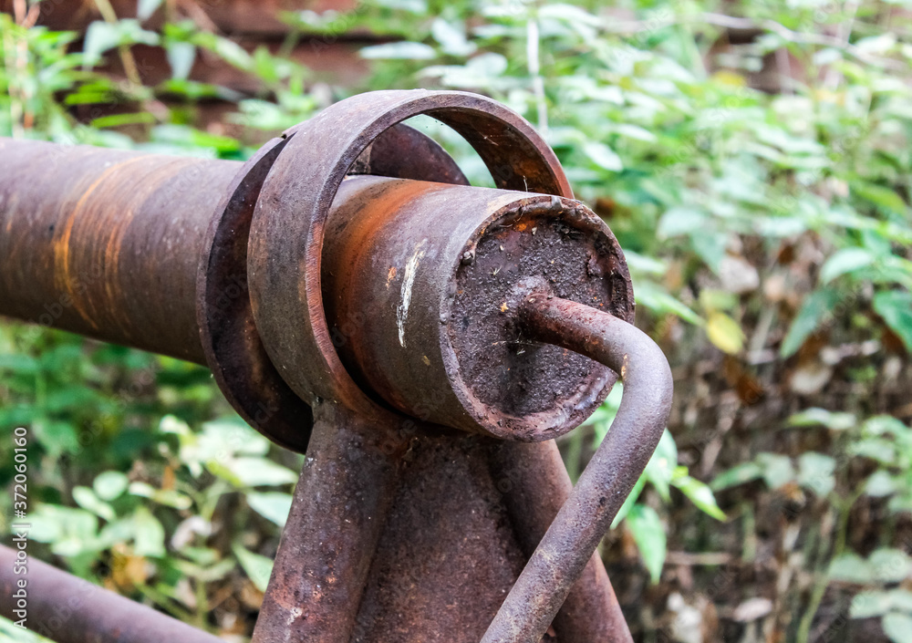 An old rusty well gate used to lift a bucket of water. An old rusty well gate used to lift a bucket of water.