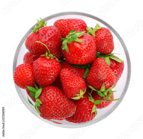 Ripe strawberries in bowl isolated on white, top view