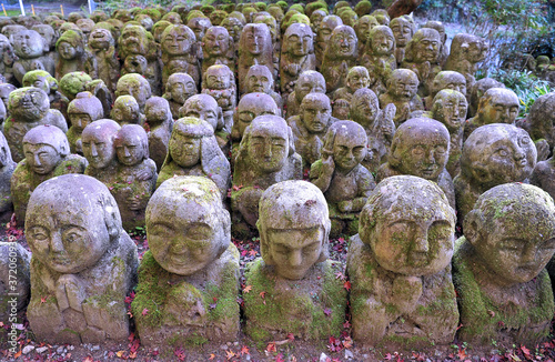 Wonderful stone statues in buddhist temple in Kyoto - Otagi Nenbutsuji. photo