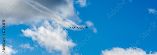 Картината върху платно Panorama of fighter jets against a cloudy blue sky