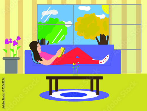 
Mujer recostada en el sofá de su sala de estar, leyendo un libro en su tiempo libre, con la luz del sol entrando por su ventana