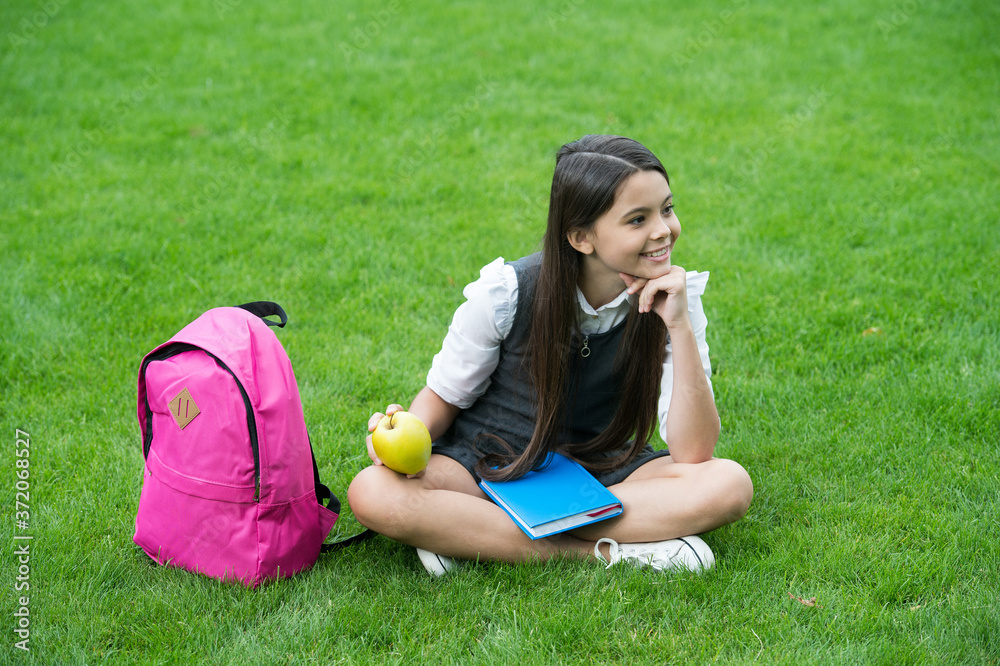 Your health is your wealth. Happy child relax on green grass. Healthy snack. School break. Health education. Natural diet. Dental health. Oral hygiene. Dental care habits. Child care and health Your health is your wealth. Happy child relax on green grass. Healthy snack. School break. Health education. Natural diet. Dental health. Oral hygiene. Dental care habits. Child care and health