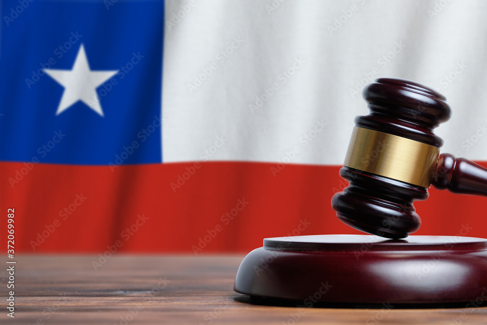 Justice and court concept in Republic of Chile. Judge hammer on a flag background